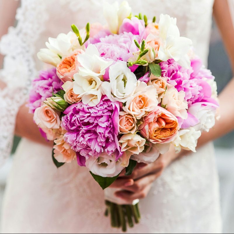 Midsection Of Bride Holding Bouquet